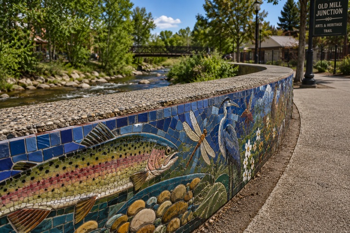 Detailed ceramic mosaic panels along the Deer Head Creek pedestrian path.